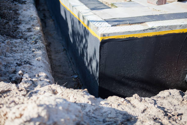 Professional Waterproofing technician working in Derby, KS